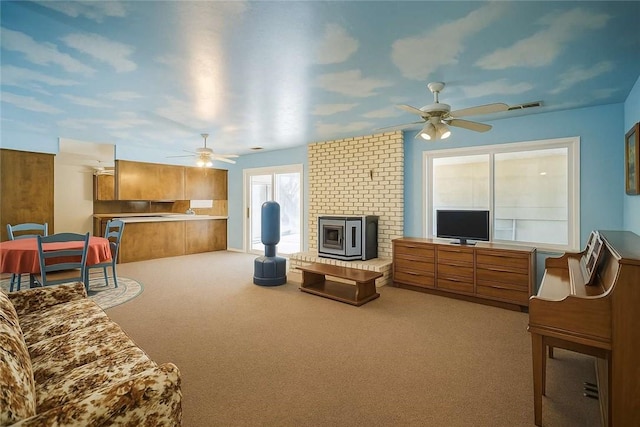 31736 Apache Rd, Coarsegold, CA 93614 - carpeted living room featuring a ceiling fan and a fireplace