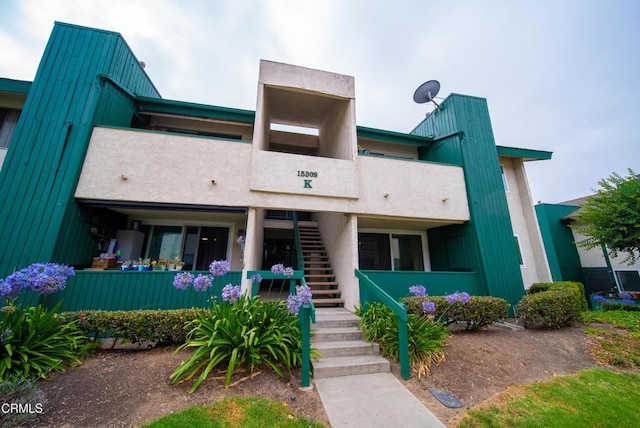 15309 Santa Gertrudes Ave Unit K101, La Mirada, CA 90638 - view of building exterior featuring stairway