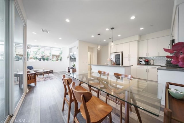 117 N 5th St Unit B, Montebello, CA 90640 - dining room featuring wood finished floors and recessed lighting