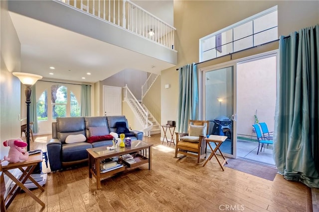 66 Glenalmond Ln, Ladera Ranch, CA 92694 - living area featuring hardwood / wood-style floors, stairway, a high ceiling, and recessed lighting
