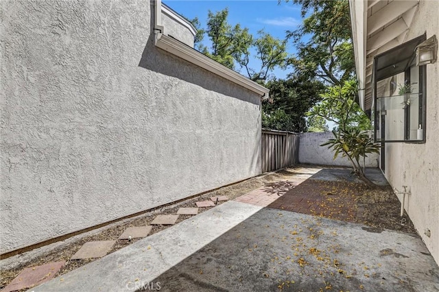 17 Gladstone, Irvine, CA 92606 - view of property exterior featuring stucco siding and a patio
