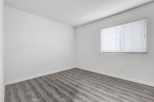 17 Gladstone, Irvine, CA 92606 - unfurnished room featuring wood finished floors and baseboards