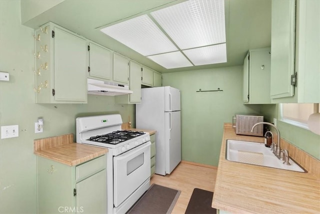 9100 Acacia Ave Unit 6, Fontana, CA 92335 - kitchen with white appliances, under cabinet range hood, light wood finished floors, and light countertops