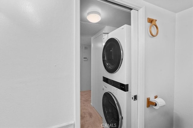 9100 Acacia Ave Unit 6, Fontana, CA 92335 - laundry area with stacked washing machine and dryer and carpet floors