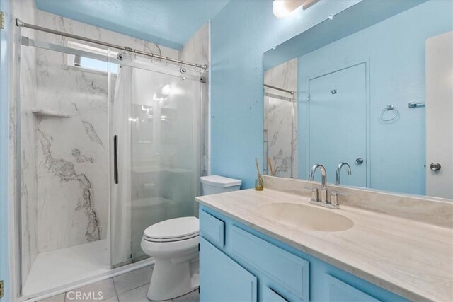 9100 Acacia Ave Unit 6, Fontana, CA 92335 - full bathroom featuring a marble finish shower, vanity, and tile patterned flooring