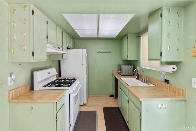 9100 Acacia Ave Unit 6, Fontana, CA 92335 - kitchen with white appliances, under cabinet range hood, light wood-style flooring, and light countertops