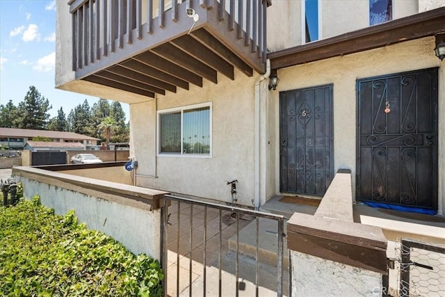 9100 Acacia Ave Unit 6, Fontana, CA 92335 - doorway to property featuring stucco siding