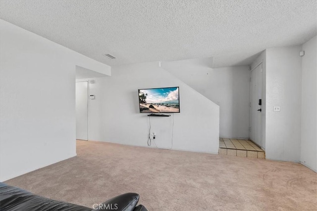 9100 Acacia Ave Unit 6, Fontana, CA 92335 - carpeted living room featuring a textured ceiling
