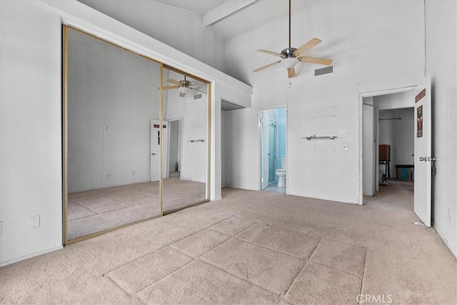 9100 Acacia Ave Unit 6, Fontana, CA 92335 - unfurnished bedroom with carpet flooring, beamed ceiling, connected bathroom, high vaulted ceiling, and ceiling fan