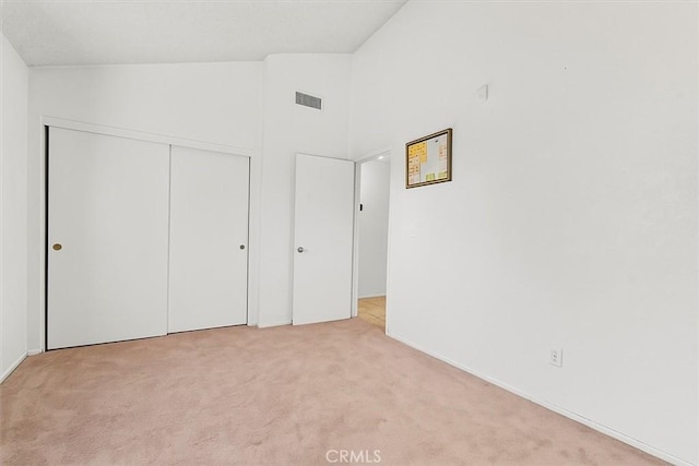 9100 Acacia Ave Unit 6, Fontana, CA 92335 - unfurnished bedroom with carpet, a closet, and high vaulted ceiling