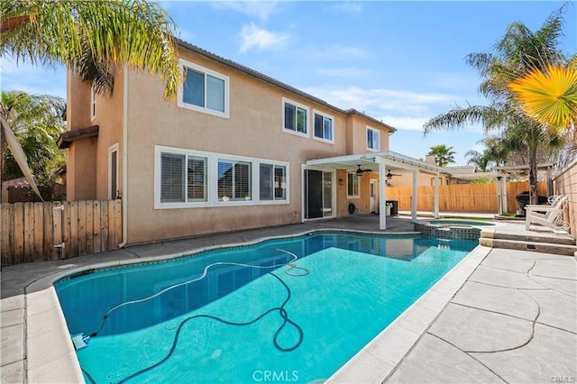 29851 Fox Creek Dr, Menifee, CA 92586 - view of pool with a ceiling fan, a patio area, a fenced backyard, and a pool with connected hot tub