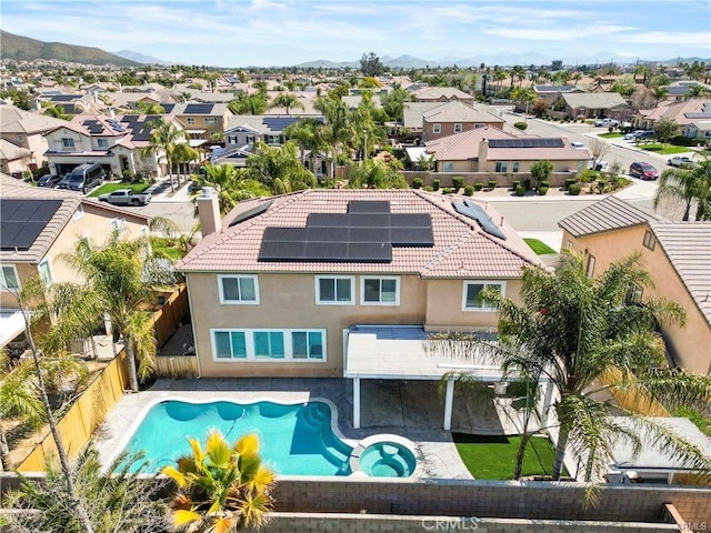 29851 Fox Creek Dr, Menifee, CA 92586 - view of swimming pool with a residential view, a fenced backyard, a pool with connected hot tub, a patio, and a mountain view