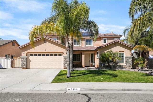 29851 Fox Creek Dr, Menifee, CA 92586 - mediterranean / spanish home with a gate, stucco siding, a tiled roof, roof mounted solar panels, and concrete driveway
