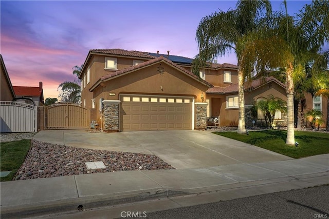 29851 Fox Creek Dr, Menifee, CA 92586 - mediterranean / spanish house with a gate, a tiled roof, stucco siding, and a garage