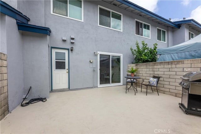16509 Caballero Ln Unit 30B, Huntington Beach, CA 92649 - back of property with a patio area and stucco siding