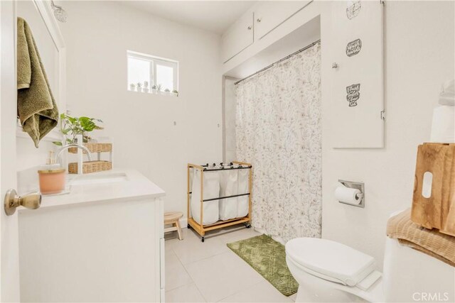 764 W 107th St, Los Angeles, CA 90044 - bathroom featuring vanity, tile patterned flooring, and curtained shower