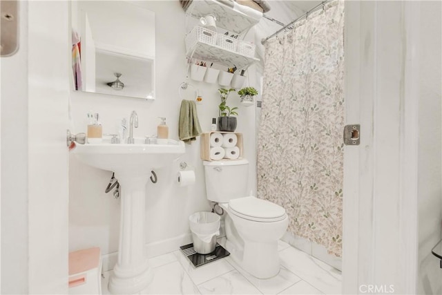 764 W 107th St, Los Angeles, CA 90044 - full bathroom with a shower with curtain and marble finish flooring