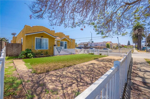 764 W 107th St, Los Angeles, CA 90044 - view of front of property with stucco siding and a residential view