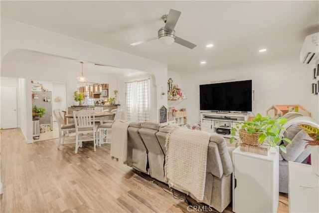 764 W 107th St, Los Angeles, CA 90044 - living room with a wall mounted AC, ceiling fan, light wood-type flooring, and recessed lighting