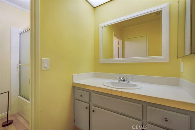 1050 Windmill Ln, Oak Park, CA 91377 - bathroom featuring vanity and bath / shower combo with glass door
