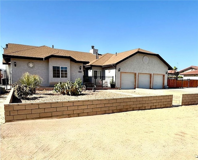 2476 Old Nadeau Rd, Palmdale, CA 93550 - ranch-style house with stucco siding, a garage, and driveway