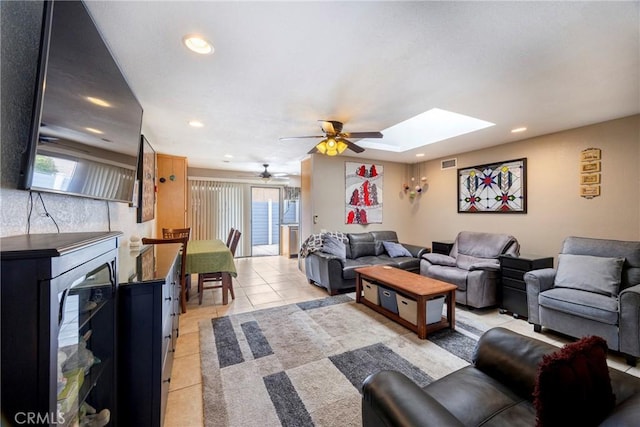 4004 E Horseshoe Ln Unit 54, Anaheim, CA 92807 - living room with light tile patterned flooring, ceiling fan, plenty of natural light, recessed lighting, and a skylight
