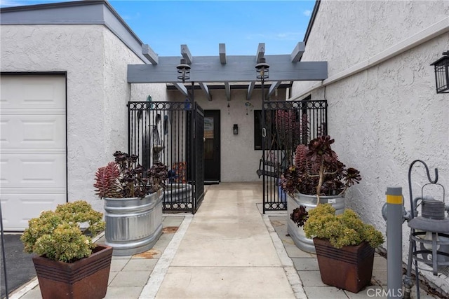 4004 E Horseshoe Ln Unit 54, Anaheim, CA 92807 - doorway to property with stucco siding and a gate