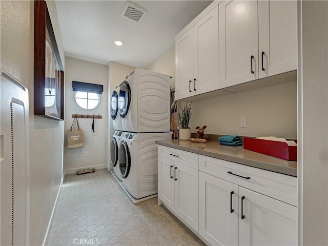 17151 Kent St, Hesperia, CA 92345 - laundry area featuring cabinet space, estacked washer and dryer, recessed lighting, and light tile patterned flooring