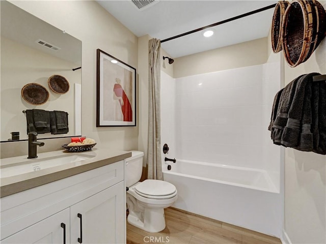 17151 Kent St, Hesperia, CA 92345 - bathroom featuring wood finished floors, vanity, and shower / tub combo