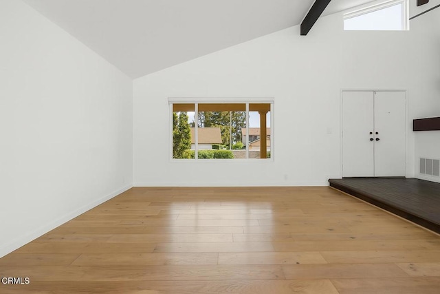 2325 Parkway Dr, Camarillo, CA 93010 - empty room featuring high vaulted ceiling, beamed ceiling, and light wood-style flooring