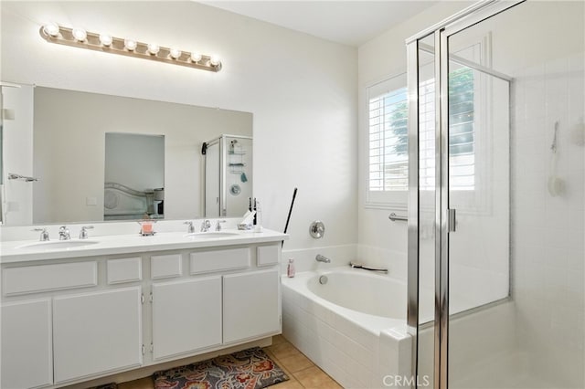 13525 Evanston St, Victorville, CA 92392 - bathroom featuring a stall shower, a garden tub, double vanity, and tile patterned floors