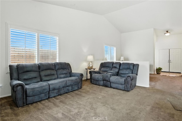 13525 Evanston St, Victorville, CA 92392 - living area featuring carpet flooring, plenty of natural light, and vaulted ceiling