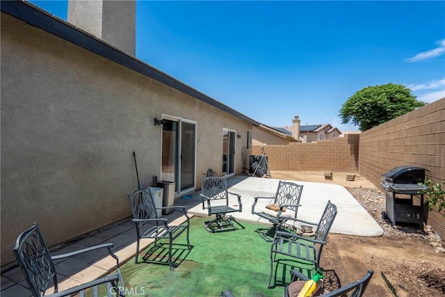 13525 Evanston St, Victorville, CA 92392 - fenced backyard with grilling area and a patio