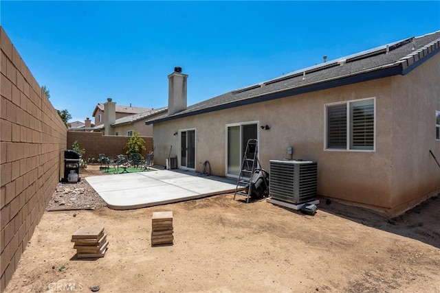 13525 Evanston St, Victorville, CA 92392 - rear view of property featuring a patio area, stucco siding, and a chimney