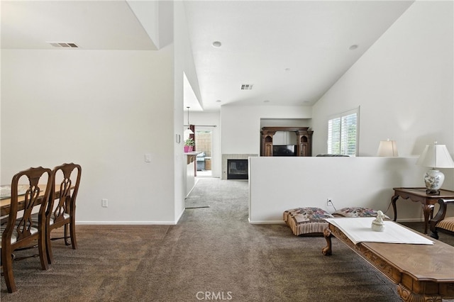 13525 Evanston St, Victorville, CA 92392 - carpeted living room featuring vaulted ceiling and a tiled fireplace