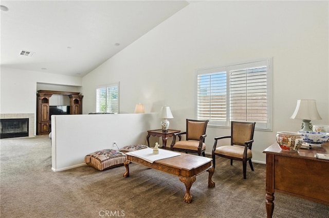 13525 Evanston St, Victorville, CA 92392 - sitting room featuring carpet, high vaulted ceiling, and a tiled fireplace