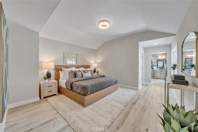 39 Cape Cod, Irvine, CA 92620 - bedroom featuring light wood-style flooring, lofted ceiling, and connected bathroom