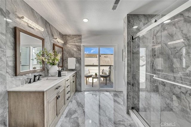 39 Cape Cod, Irvine, CA 92620 - full bath with marble tiled floors, double vanity, and a marble finish shower