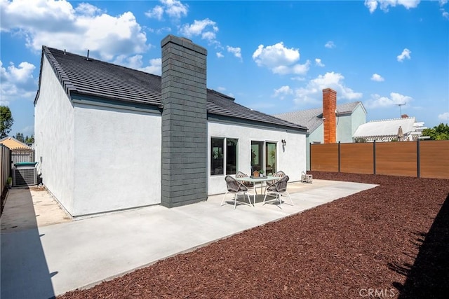 39 Cape Cod, Irvine, CA 92620 - rear view of property featuring a fenced backyard, stucco siding, and a patio area