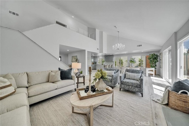 39 Cape Cod, Irvine, CA 92620 - living area featuring a chandelier, light wood-style floors, and high vaulted ceiling