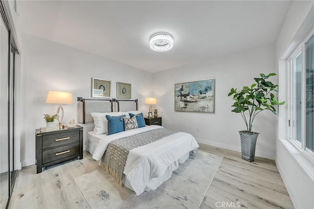 39 Cape Cod, Irvine, CA 92620 - bedroom with light wood-style floors and multiple windows