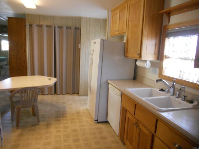 955 Howard Ave Unit 40, Escondido, CA 92029 - kitchen with white dishwasher, light countertops, light flooring, and brown cabinets