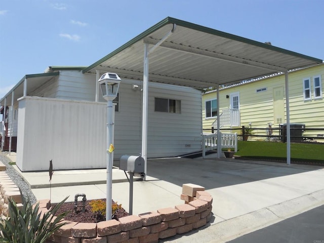 955 Howard Ave Unit 40, Escondido, CA 92029 - rear view of property featuring a detached carport and driveway