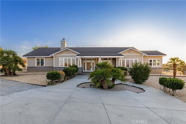 35655 52nd St E, Palmdale, CA 93552 - ranch-style house with stone siding and a chimney