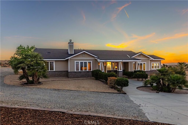 35655 52nd St E, Palmdale, CA 93552 - single story home with stone siding and a chimney