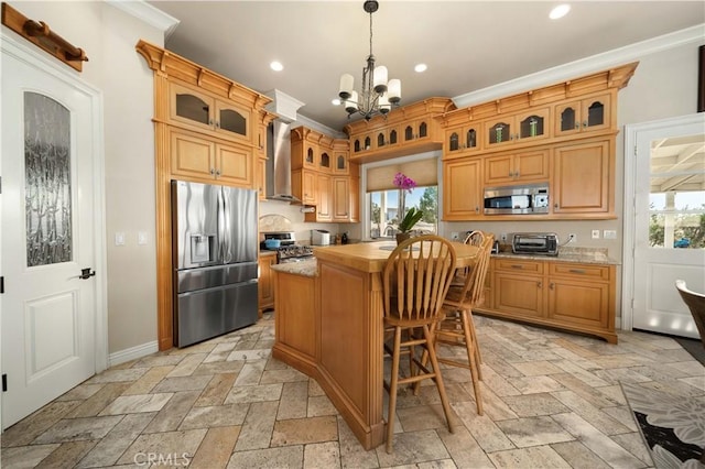 35655 52nd St E, Palmdale, CA 93552 - kitchen with appliances with stainless steel finishes, a chandelier, a center island, wall chimney exhaust hood, and stone tile floors