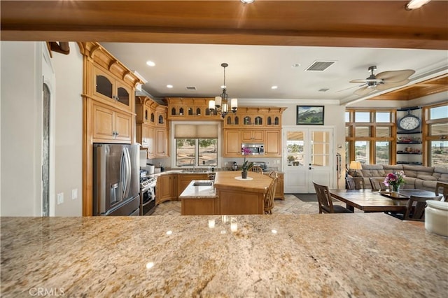 35655 52nd St E, Palmdale, CA 93552 - kitchen featuring stainless steel appliances, a center island with sink, ceiling fan, light stone countertops, and recessed lighting