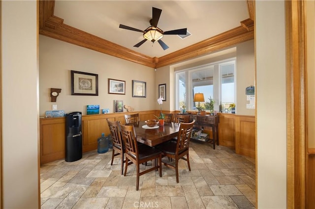 35655 52nd St E, Palmdale, CA 93552 - dining area featuring stone tile floors, crown molding, wainscoting, and ceiling fan