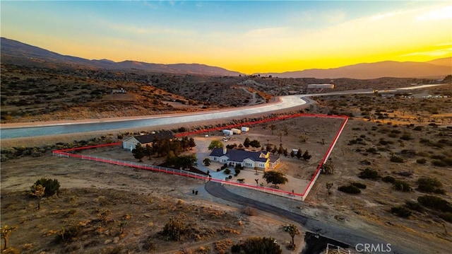 35655 52nd St E, Palmdale, CA 93552 - aerial view at dusk of a mountain view, property boundaries highlighted, view of desert landscape, and a rural view