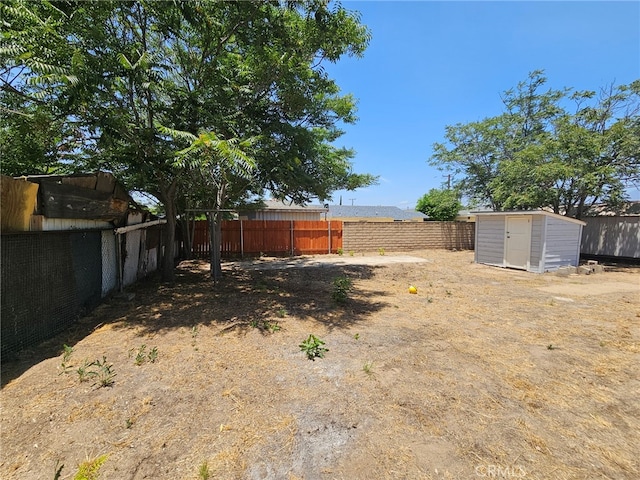 26483 9th St, Highland, CA 92346 - fenced backyard featuring a storage unit